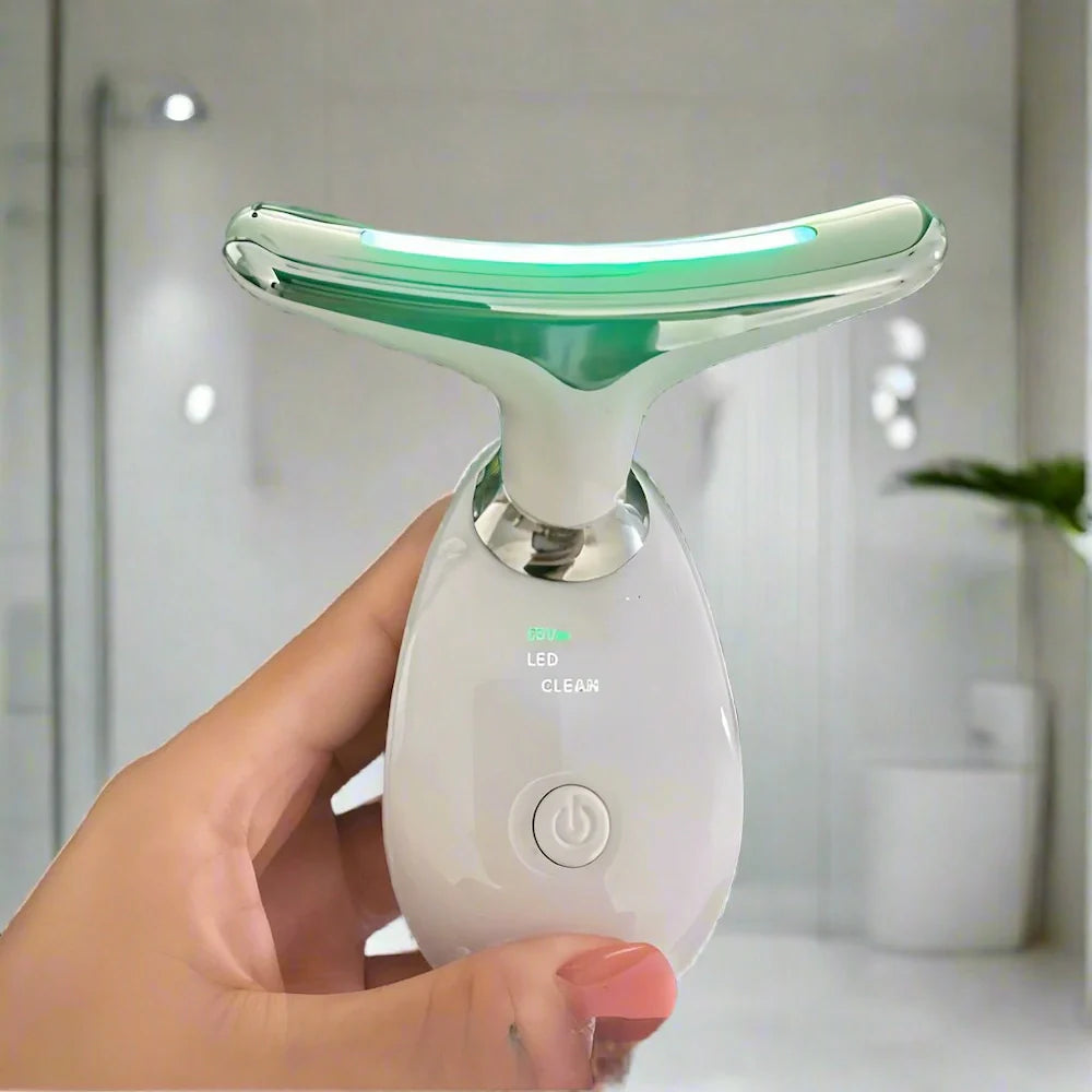 Hand holding LED device with green light for skin rejuvenation